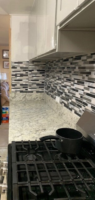 Installed new wall tile backsplash with quartz countertop